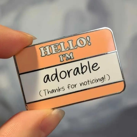 Cunning Linguist Enamel Pin: Hello! I'm Adorable cover image