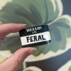 Cunning Linguist Enamel Pin: Hello! I'm Feral cover image