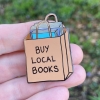 Dissent Pins: Buy Local Books Pin cover image