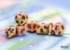 Chessex Mega-Polyhedral 7-Die Set: Festive (Black Light Reactive) - Circus/Black cover image